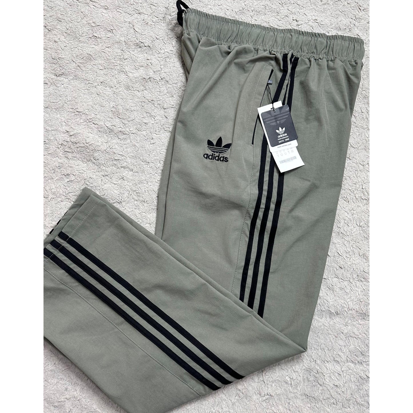 ADIDAS OLIVE GREEN TRACK PANTS FOR MEN – ICONIC THREE-STRIPE CASUAL SPORTSWEAR