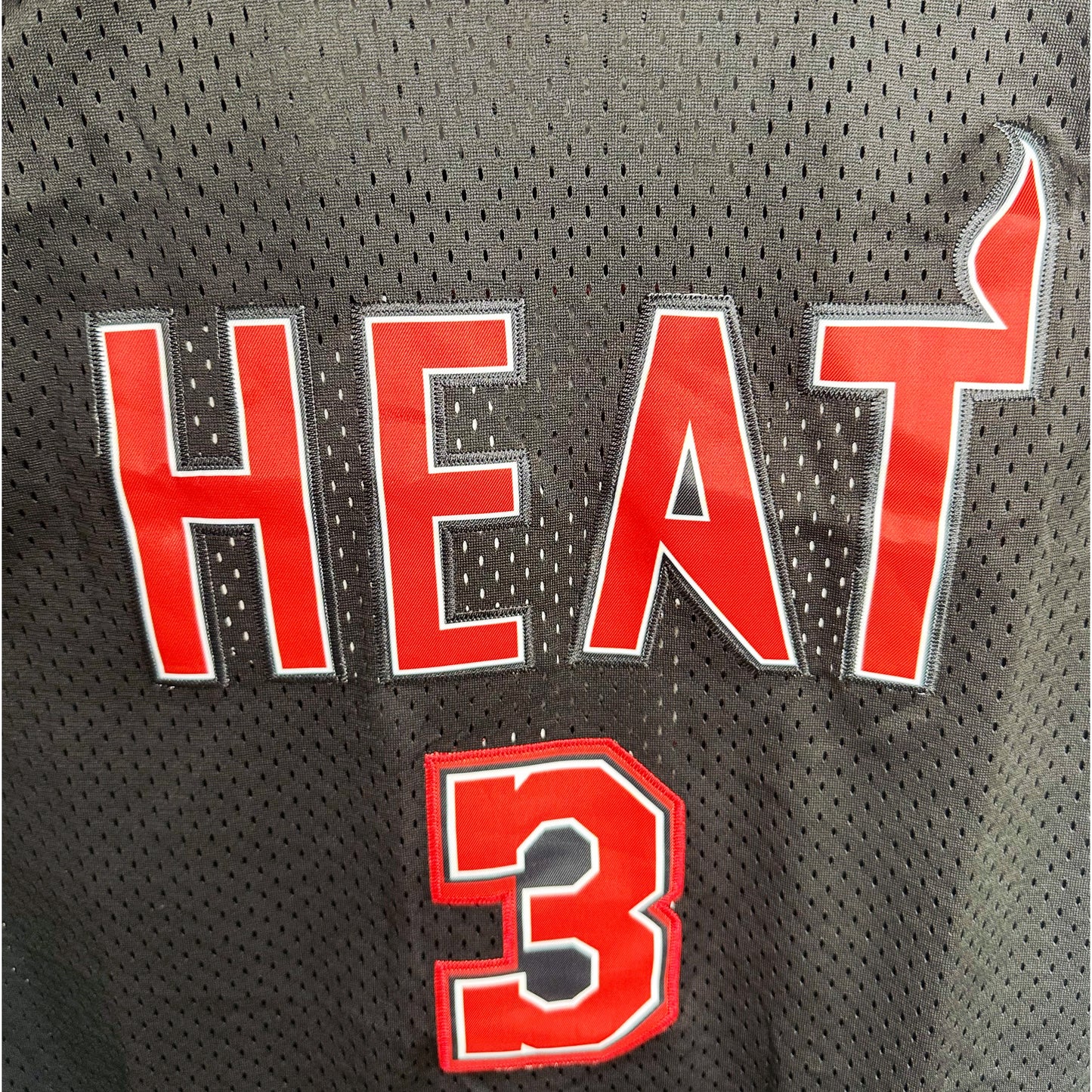 Miami Heat Hardwood Classics black jersey, inspired by the team’s classic late-1980s look and reissued by Mitchell & Ness