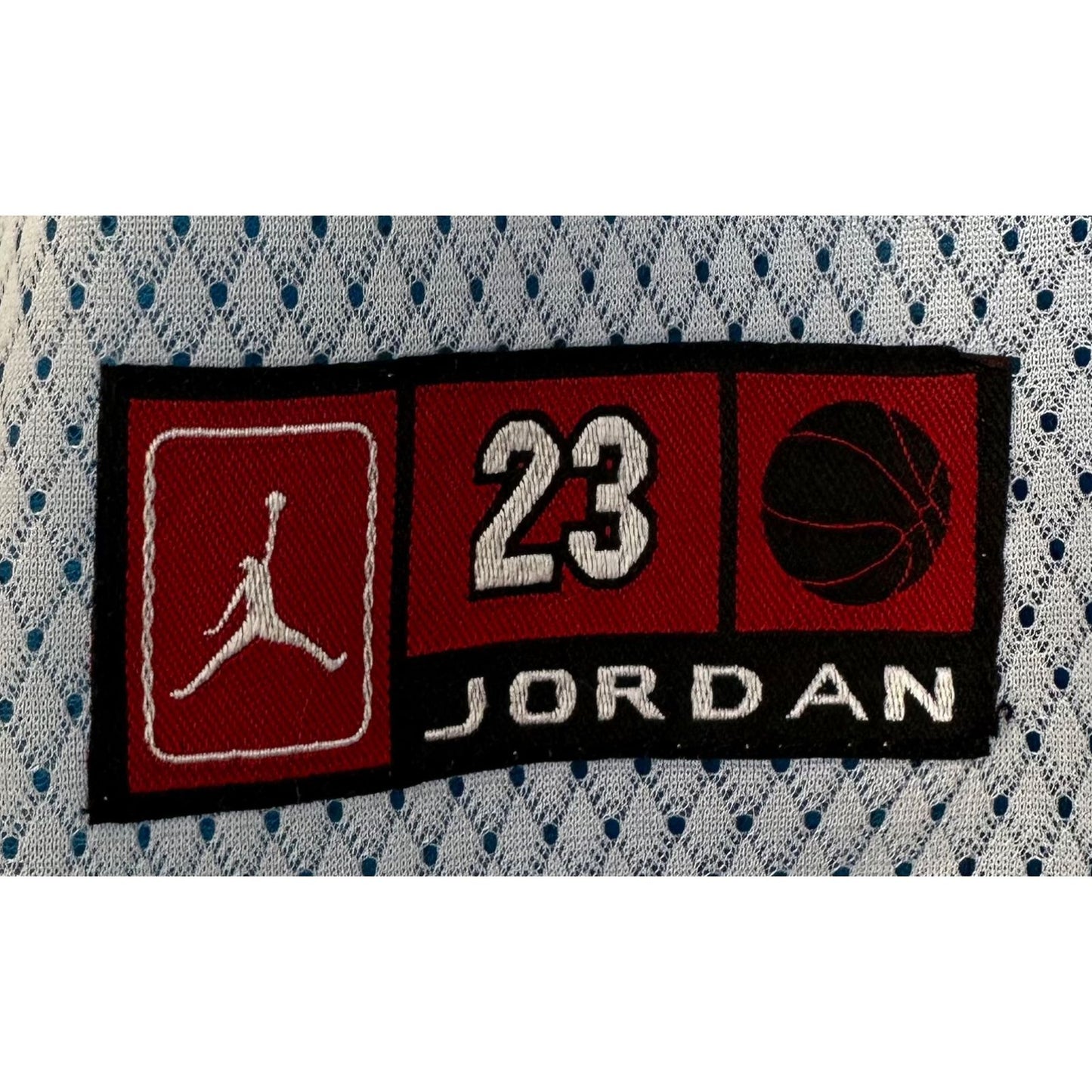 JORDAN WHITE AND BLUE SIZE-L DOUBLE SIDED BASKETBALL JERSEYS