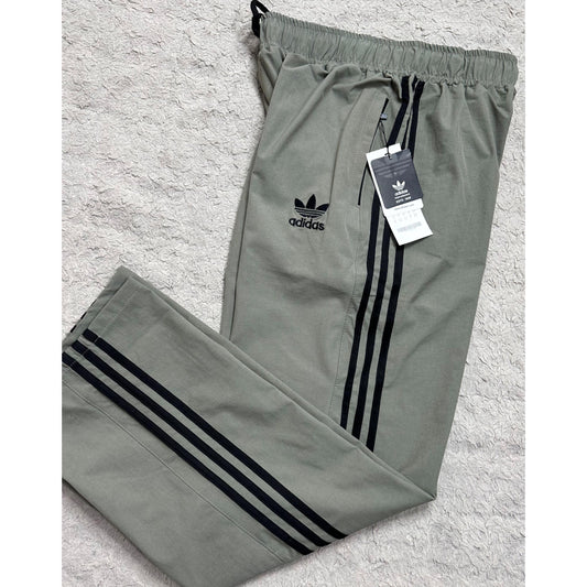 ADIDAS OLIVE GREEN TRACK PANTS FOR MEN – ICONIC THREE-STRIPE CASUAL SPORTSWEAR