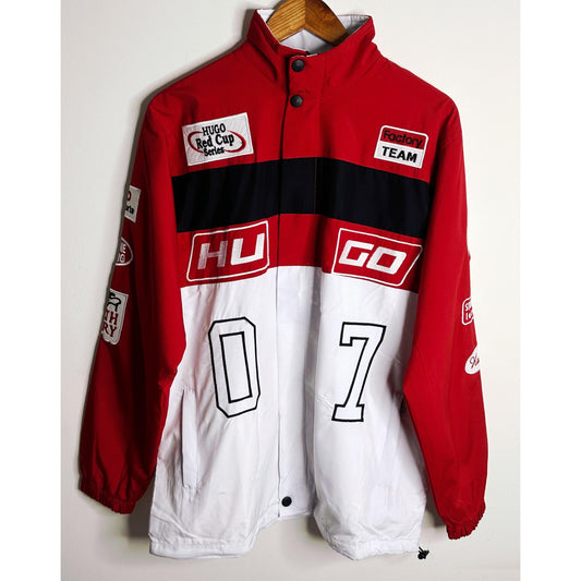 A high-impact colour-blocked jacket in a straight fit by HUGO Menswear, designed in strong cotton twill with racing-inspired badges and embroidery. Regular fit, point collar, fastening top: zip closure, pockets top: Patch pockets, inside zip pockets, ribb