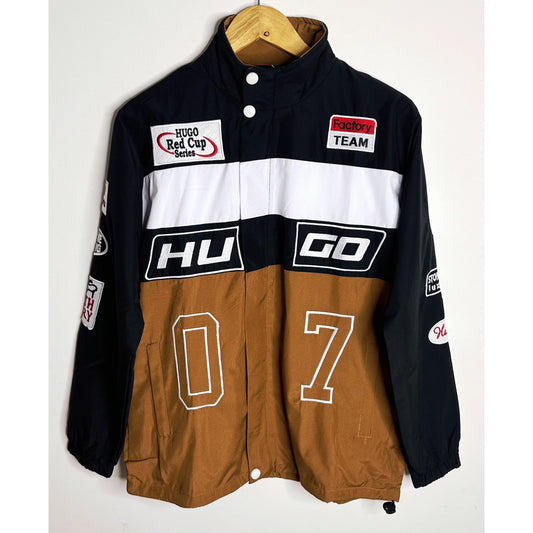 A high-impact colour-blocked jacket in a straight fit by HUGO Menswear, designed in strong cotton twill with racing-inspired badges and embroidery. Regular fit, point collar, fastening top: zip closure, pockets top: Patch pockets, inside zip pockets, ribb
